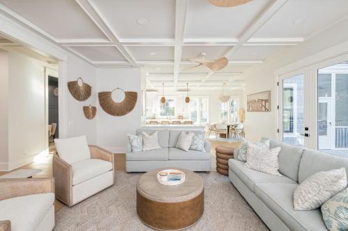 a living room with two couches and a table at 3151 Baywood Drive in Seabrook Island