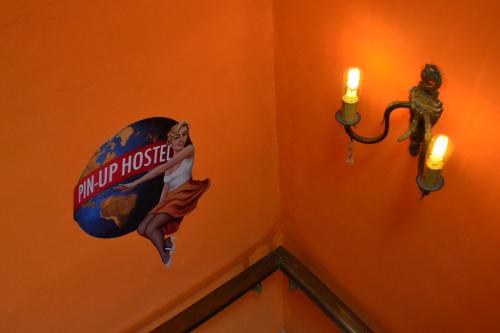 a wall with a sign that says trump house on it at Pin-up hostel in Rosario