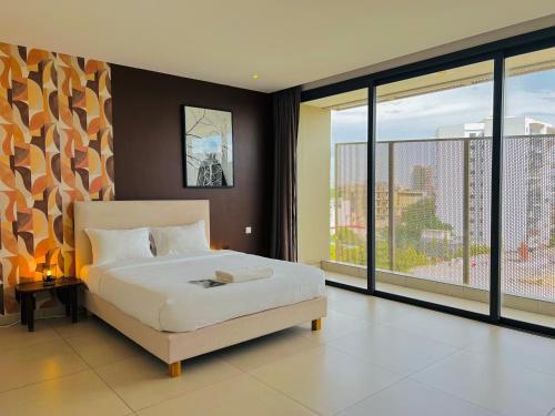 Giường trong phòng chung tại AfricaWorks Suites