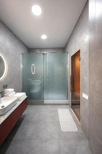 a bathroom with a shower and a sink at SPA Hotel Galera in Kyiv