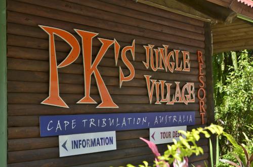 a sign on the side of a building at PK's Jungle Village in Cape Tribulation