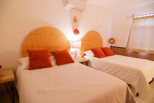 Ένα ή περισσότερα κρεβάτια σε δωμάτιο στο Casa Amma - Amma