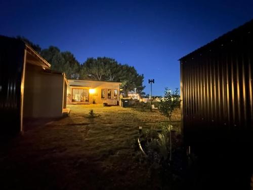 a house in a yard at night at Posada Bliss in Punta del Este