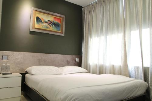 M Design Hotel @ Seri Kembanganにあるベッド
