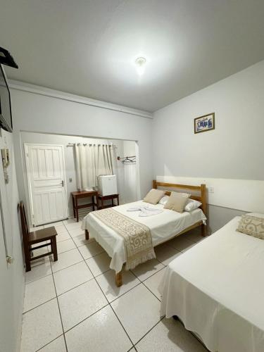 Postel nebo postele na pokoji v ubytování Hotel Monte Carlo - Cáceres