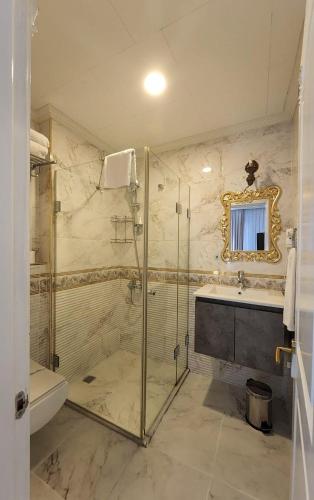 a bathroom with a shower and a sink at Leyenda Boutıque Hotel in Istanbul