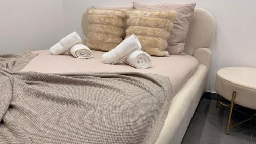 En eller flere senge i et værelse på Luxueux appartement T3