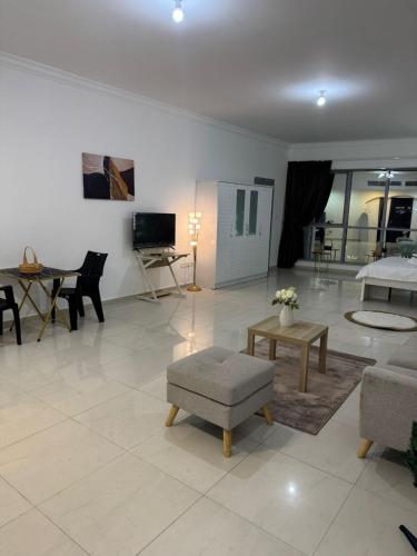 a living room with a couch and a table at SN REAL ESTATE HOME in Abu Dhabi