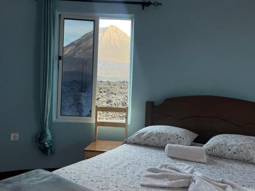 Postel nebo postele na pokoji v ubytování Casa Adriano & Filomena