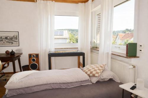 Ένα ή περισσότερα κρεβάτια σε δωμάτιο στο Homestay - Panoramablick über Büdingen