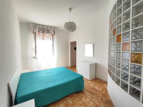 En eller flere senge i et værelse på Appartamento vista mare vicino al mare e al centro