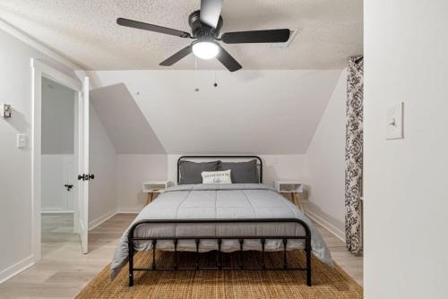 a bedroom with a bed and a ceiling fan at Billion Dollar Views in Winchester