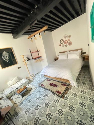 En eller flere senge i et værelse på Riad El Hania Mogador