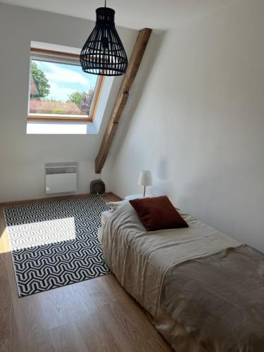 En eller flere senge i et værelse på Les Buissonnets - Gîte rural - Calme & Nature, proche Caps & Tunnel