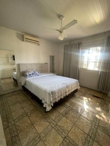 En eller flere senge i et værelse på Casa na praia de Capão da Canoa