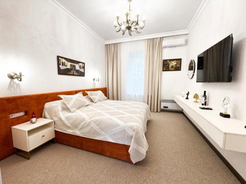 Ένα ή περισσότερα κρεβάτια σε δωμάτιο στο Wine Garden Hotel Comrat