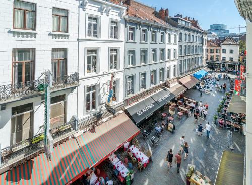 an overhead view of a street with people and buildings at Safestay Brussels Grand Place in Brussels