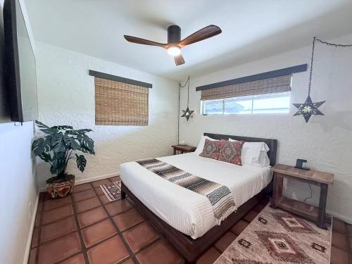 a bedroom with a bed and a ceiling fan at The Casita Collective in Scottsdale