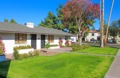 a house with a green lawn in front of it at The Casita Collective in Scottsdale