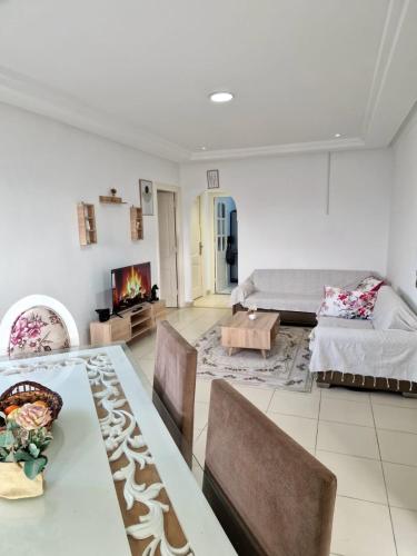 En eller flere senge i et værelse på Appartement Hammem Sousse Cosy