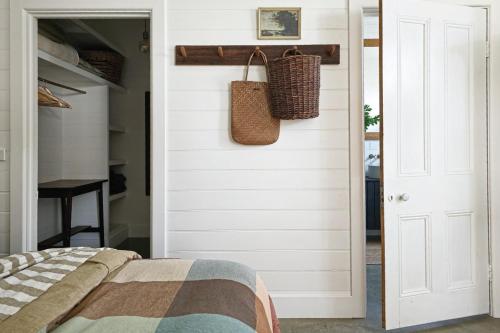 a bedroom with a bed and a closet at Sage in Glenlyon