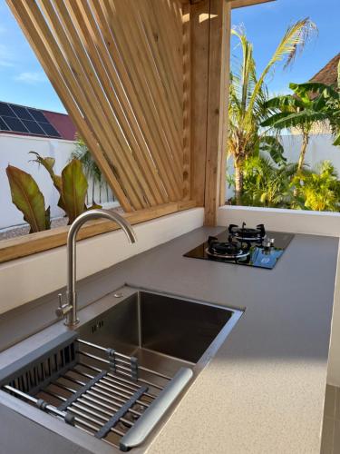 a kitchen with a sink and a window at Villa Jena 3 bedroom private pool in Nungwi