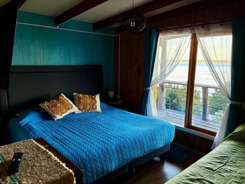 En eller flere senge i et værelse på Acogedora casa ,1 a 4 personas, lista para una linda desconexión