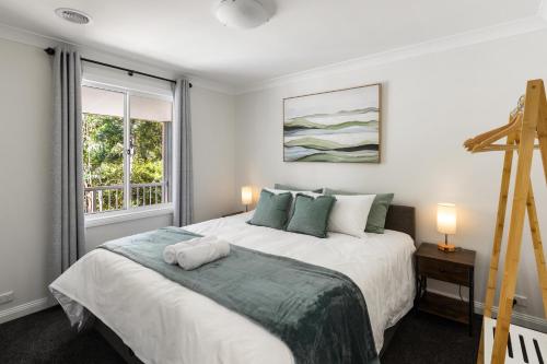 En eller flere senge i et værelse på Valley View Retreat