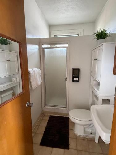 a bathroom with a toilet and a sink at Central YMCA Residences in Honolulu