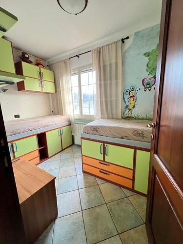 a small room with two beds and a window at Villa Giulia in Ateleta