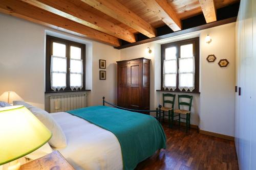 Postel nebo postele na pokoji v ubytování Gressoney House