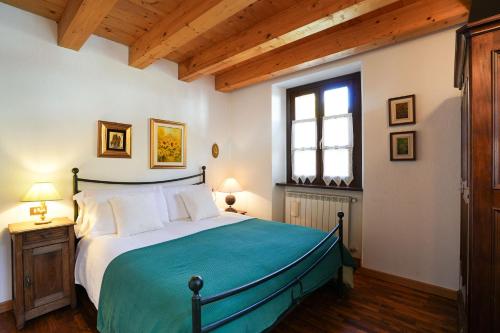 Postel nebo postele na pokoji v ubytování Gressoney House