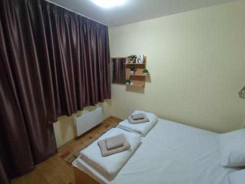 En eller flere senge i et værelse på Замъка