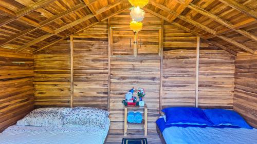 Postel nebo postele na pokoji v ubytování Jardin del Sol Ecoglamping SAS
