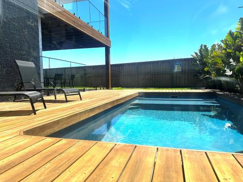 Bazén v ubytování Beach Escape with Heated Pool and Coastal Comfort nebo v jeho okolí