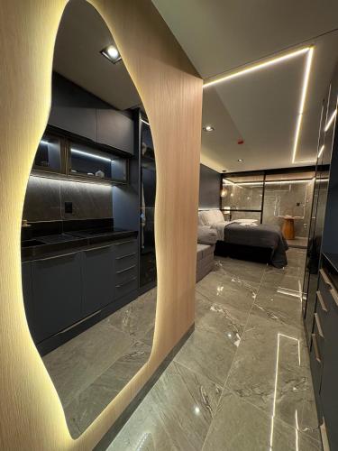 Postel nebo postele na pokoji v ubytování Flat Pé na areia com Banheira Privativa