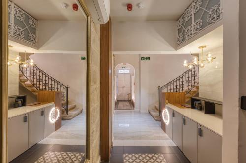 a view of a hallway with stairs in a house at 7 Main Gate in Birgu