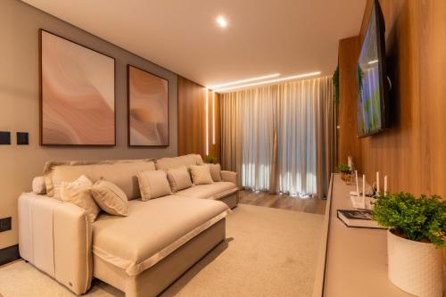 TV a/nebo společenská místnost v ubytování Apartamento de 2 suítes - 170m da Rua Coberta