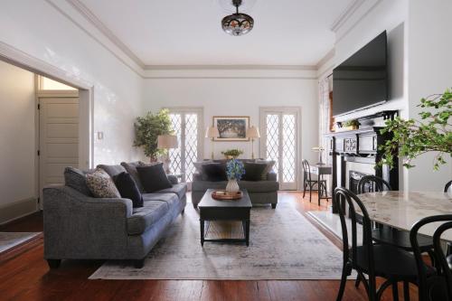 a living room with a couch and a table at Comfortable Escape in Historic Downtown Savannah in Savannah