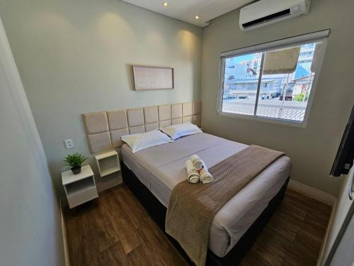 Giường trong phòng chung tại Apartamento lindo e Espaçoso