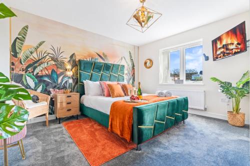 a bedroom with a bed with a green headboard at Long term stay Hot Tub EV Parking in West Bromwich