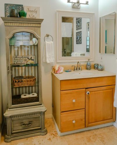 a bathroom with a sink and a mirror at 2 Bdr 2 bath luxury home steps away from Mission Beach 5 min from Belmont in San Diego