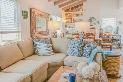 a living room with a couch and a table at 2 Bdr 2 bath luxury home steps away from Mission Beach 5 min from Belmont in San Diego