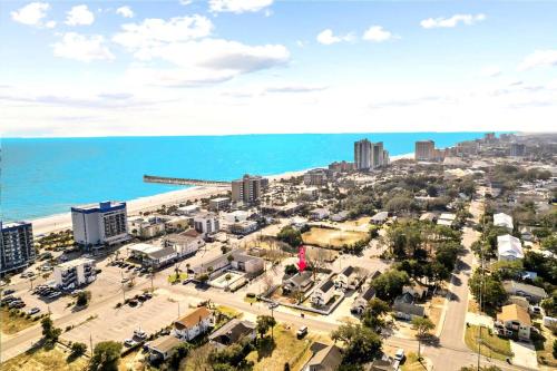 an aerial view of a city and the ocean at ﻿Charming Centrally Located Ocean View w Huge Private Yard, Patio, Firepit, & BBQ in Myrtle Beach
