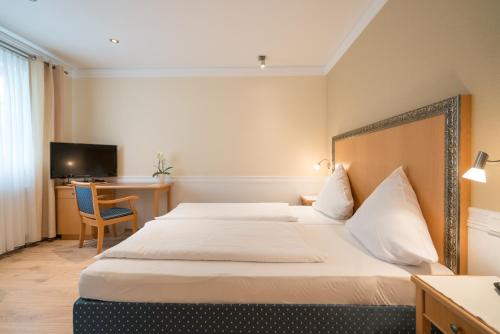 Hotel 'Zum Augarten'にあるベッド