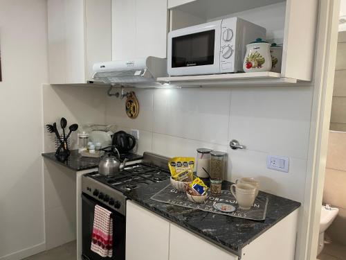 Een keuken of kitchenette bij Rosario SJ Loft