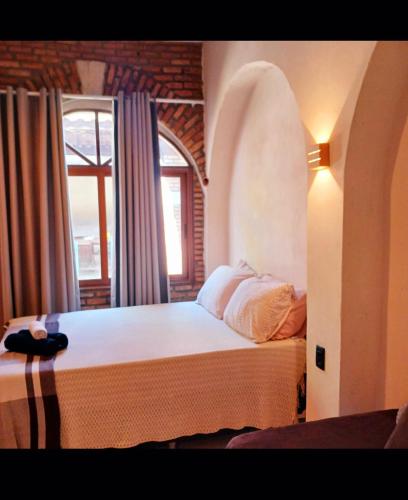 En eller flere senge i et værelse på Casa iris