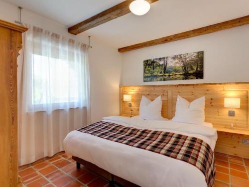 En eller flere senge i et værelse på Holiday apartment in Lübben with barbecue