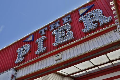 a sign for a fast food restaurant with the name of it at Hotel Coco in Felixstowe