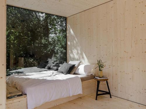 Postel nebo postele na pokoji v ubytování Holiday home treehouse Weissenhäuser Strand